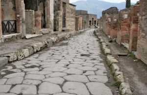 Historic cobblestone streets of Pompeii reveal the remnants of a once-thriving Roman city under the sun.